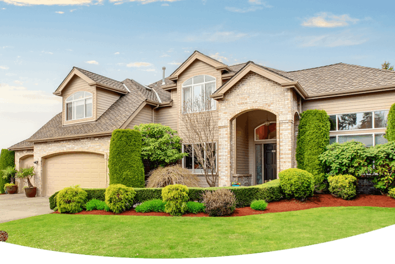 tan brick home with green front yard